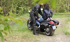 Muscled Biker Stretches Brunette % 27s pussy outdoors